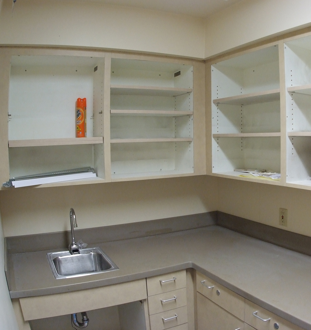 empty cabinets and sink